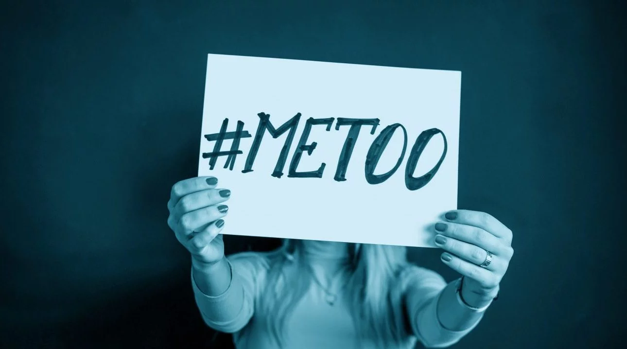 Woman holding a #MeToo sign