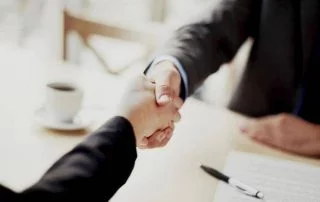 Hand shaking over a business deal