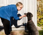 Debbie Mann, with a friend's pooch in Waterloo, Ont., plans to go full-time with her pet/owner consulting business when she retires in two years.