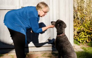 Debbie Mann, with a friend's pooch in Waterloo, Ont., plans to go full-time with her pet/owner consulting business when she retires in two years.